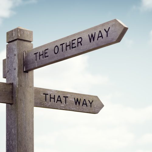Crossroad signpost saying this way, that way, the other way concept for lost, confusion or decisions