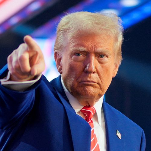 FILE PHOTO: U.S. President-elect Donald Trump gestures at Turning Point USA's AmericaFest in Phoenix, Arizona, U.S., December 22, 2024.  REUTERS/Cheney Orr/File Photo