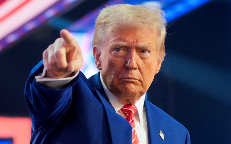 FILE PHOTO: U.S. President-elect Donald Trump gestures at Turning Point USA's AmericaFest in Phoenix, Arizona, U.S., December 22, 2024.  REUTERS/Cheney Orr/File Photo